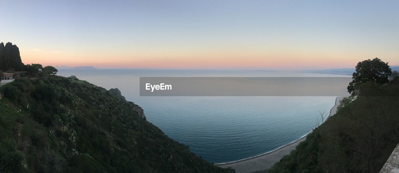 SCENIC VIEW OF SEA DURING SUNSET