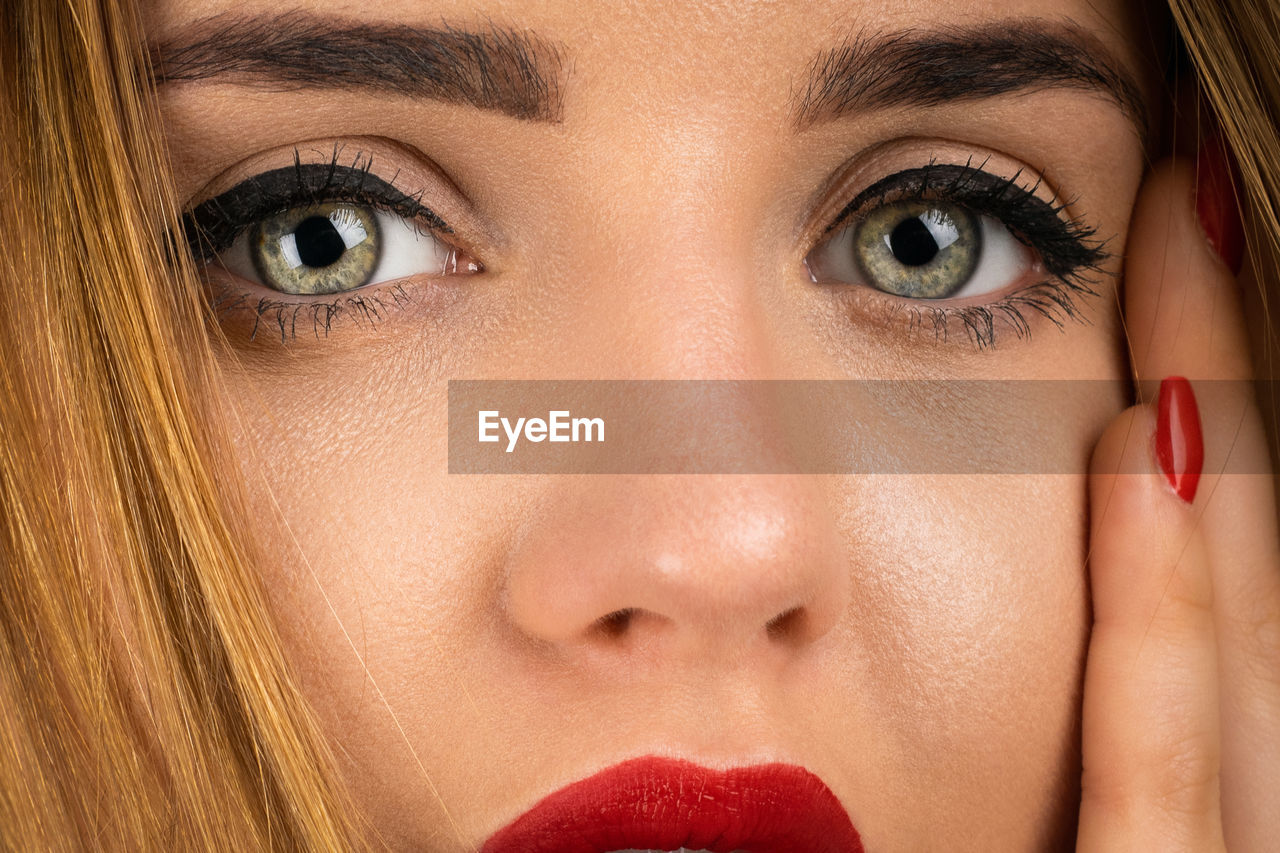 CLOSE-UP PORTRAIT OF YOUNG WOMAN WITH EYES