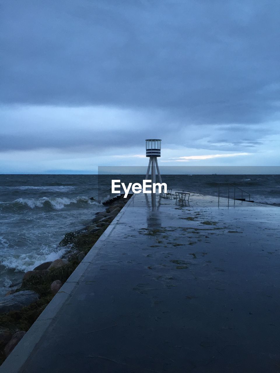 Scenic view of sea against cloudy sky