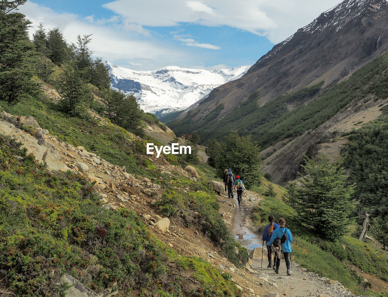 Rear view of hikers on mountain