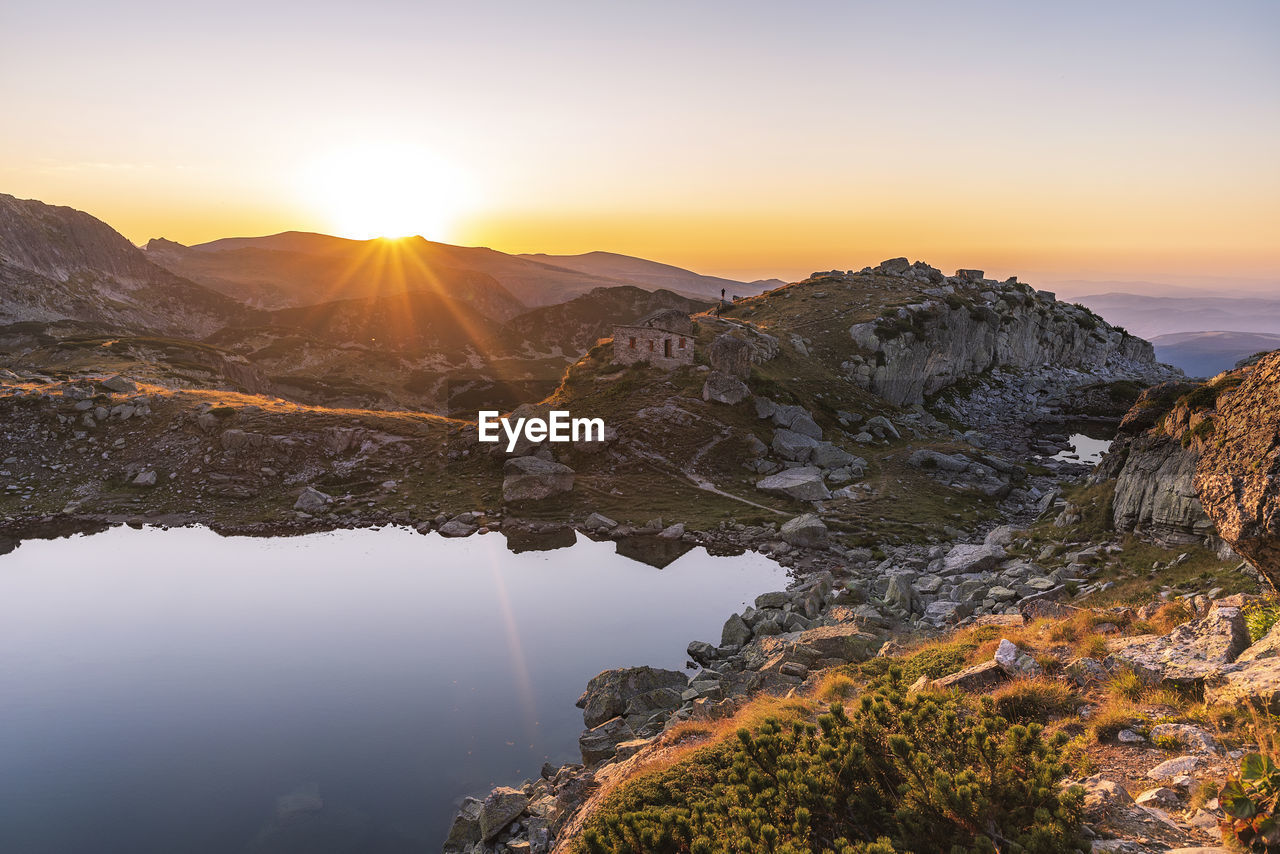 Scenic view of mountains against sky during sunset