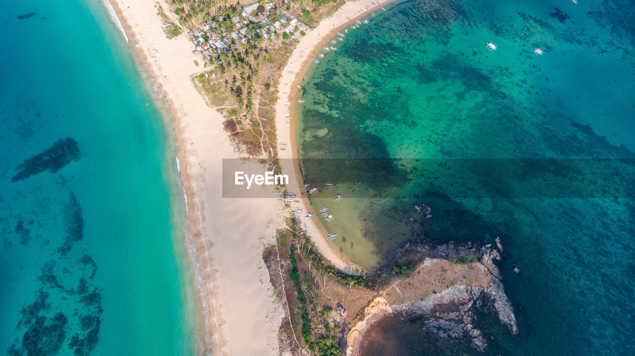 HIGH ANGLE VIEW OF SWIMMING POOL IN SEA