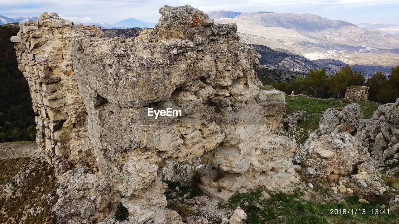 SCENIC VIEW OF TREE MOUNTAINS AGAINST SKY