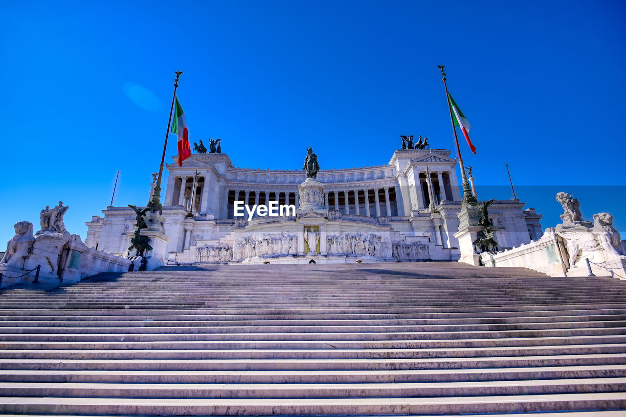 Low angle view of altar of the fatherland against clear blue sky