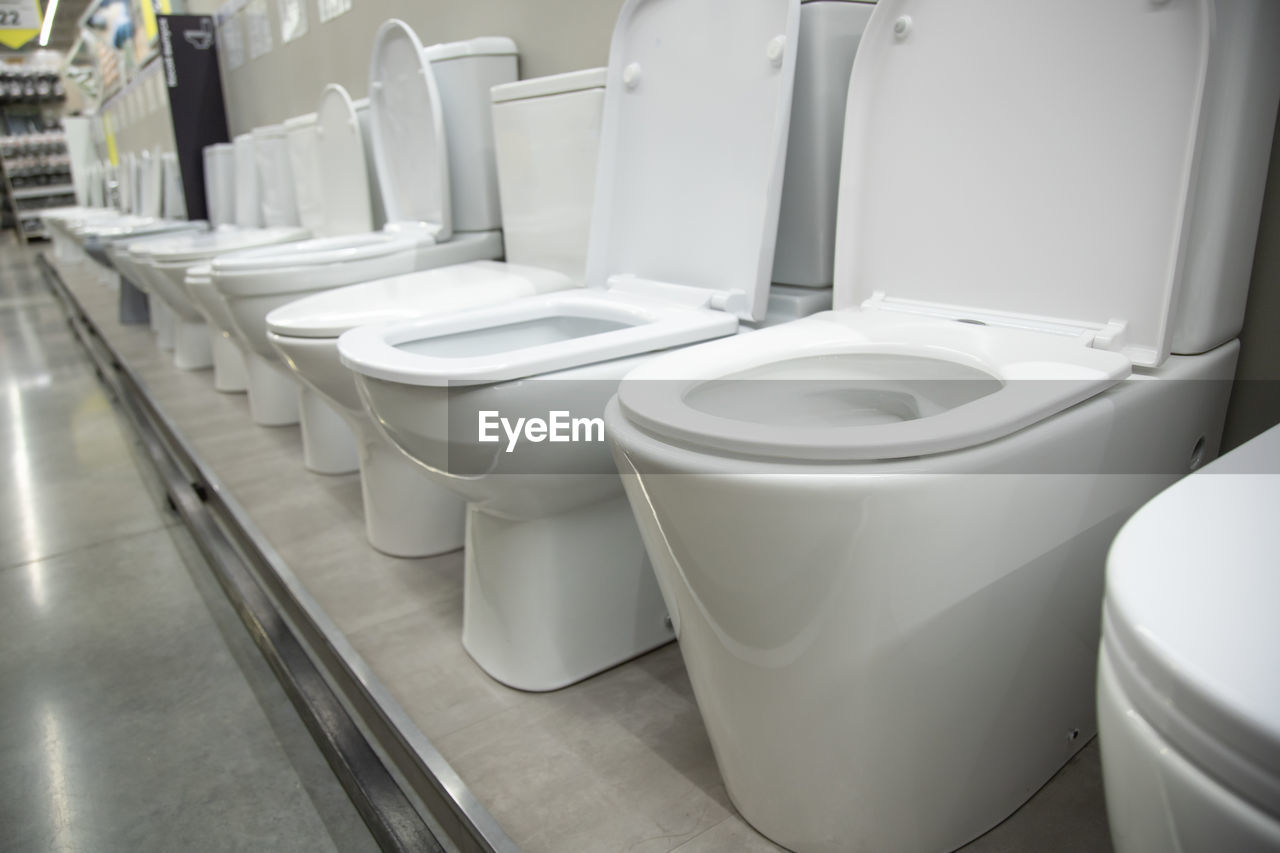 bidet, room, toilet, sink, bathroom, hygiene, indoors, plumbing fixture, public building, clean, domestic room, household equipment, home, white, toilet seat, flooring, no people, public restroom, restroom, seat, domestic bathroom, in a row