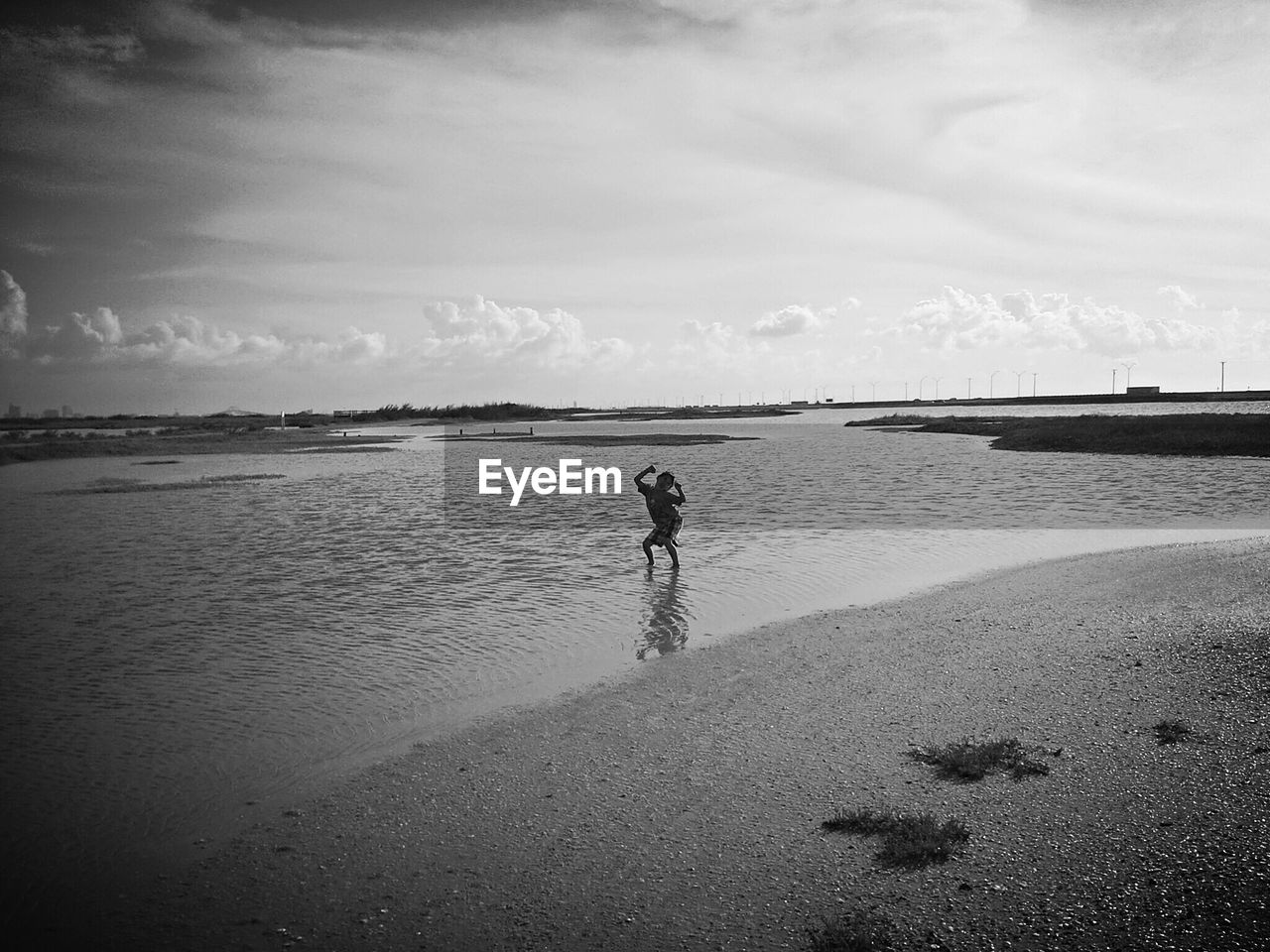 Boy playing on calm beach