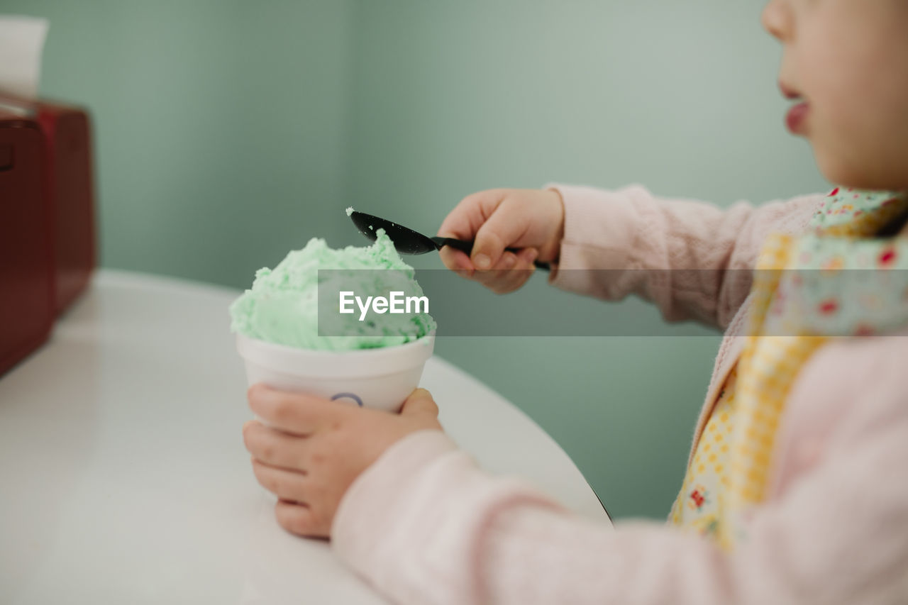 Green ice cream being eaten