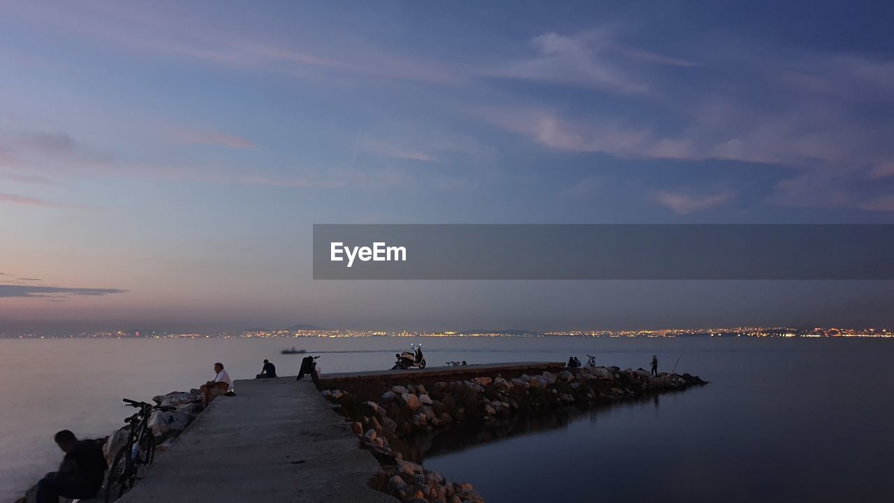 Scenic view of sea against sky at sunset