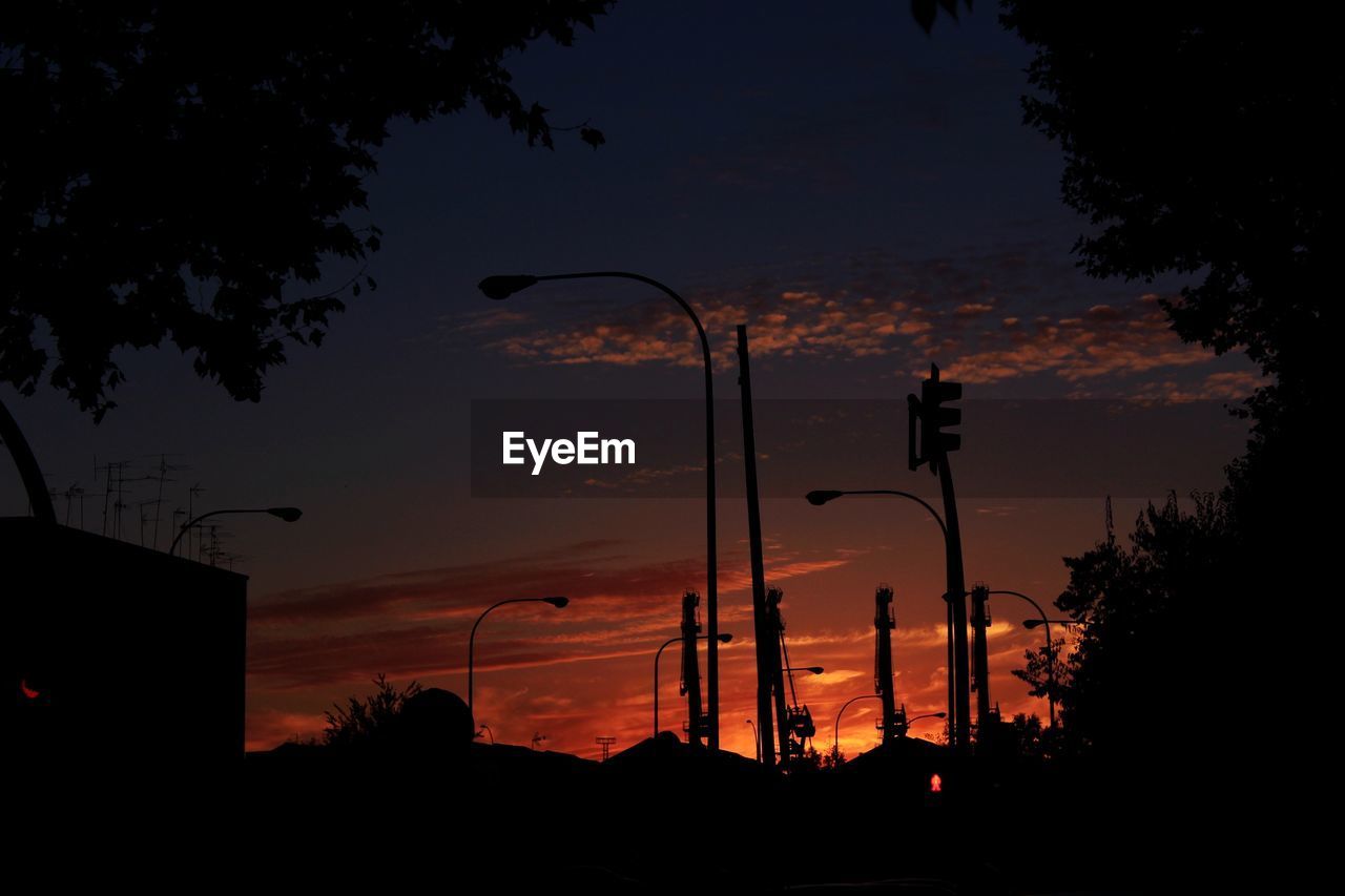 Silhouette of street lights and signals