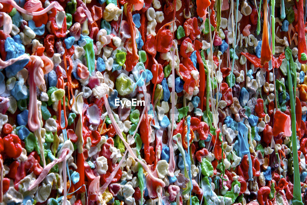 Full frame shot of multi colored chewing gum hanging at market