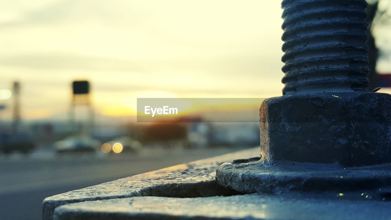 CLOSE-UP OF CAR AGAINST SKY