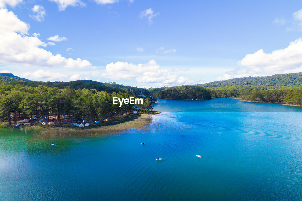 water, scenics - nature, sky, land, beauty in nature, tree, sea, nature, cloud, travel destinations, blue, body of water, tranquility, landscape, travel, environment, tranquil scene, mountain, beach, island, plant, vacation, trip, lagoon, holiday, forest, idyllic, tourism, no people, day, coastline, turquoise colored, outdoors, reservoir, tropical climate, summer, non-urban scene, nautical vessel, relaxation, bay, tourist resort, bay of water, pinaceae, reflection, sunlight