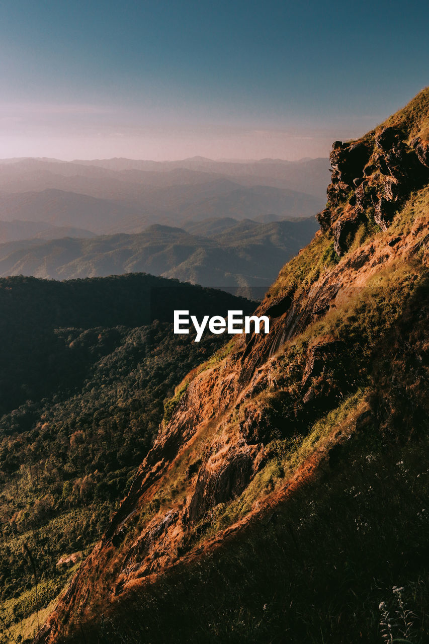 Scenic view of mountains against sky during sunset