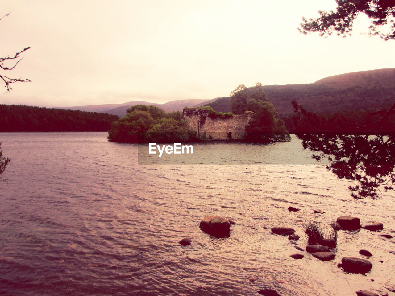 SCENIC VIEW OF LAKE AT SUNSET