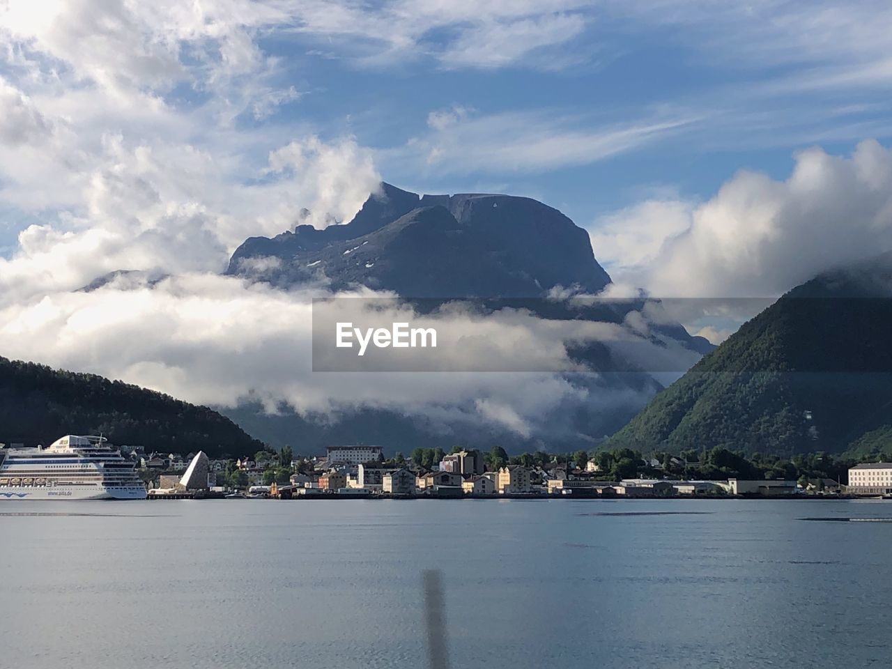 Scenic view of sea and buildings against sky