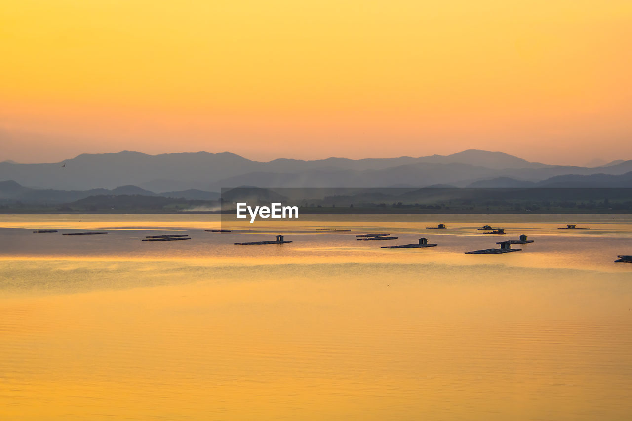 Scenic view of mountains against sky during sunset