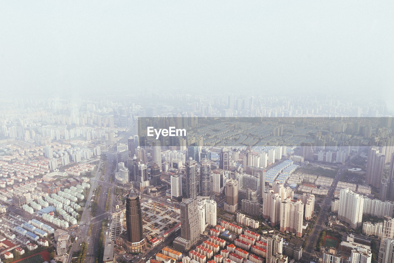 High angle view of cityscape in foggy weather