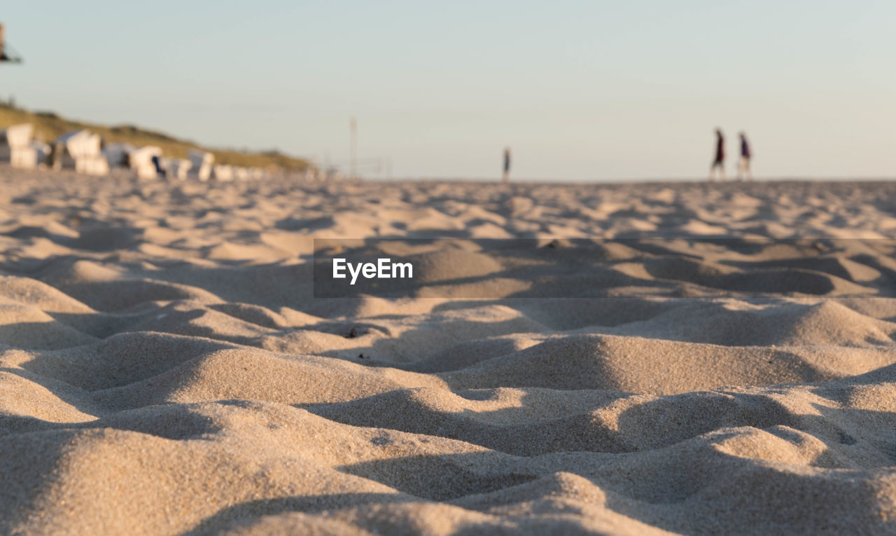 Scenic view of sandy beach against sky