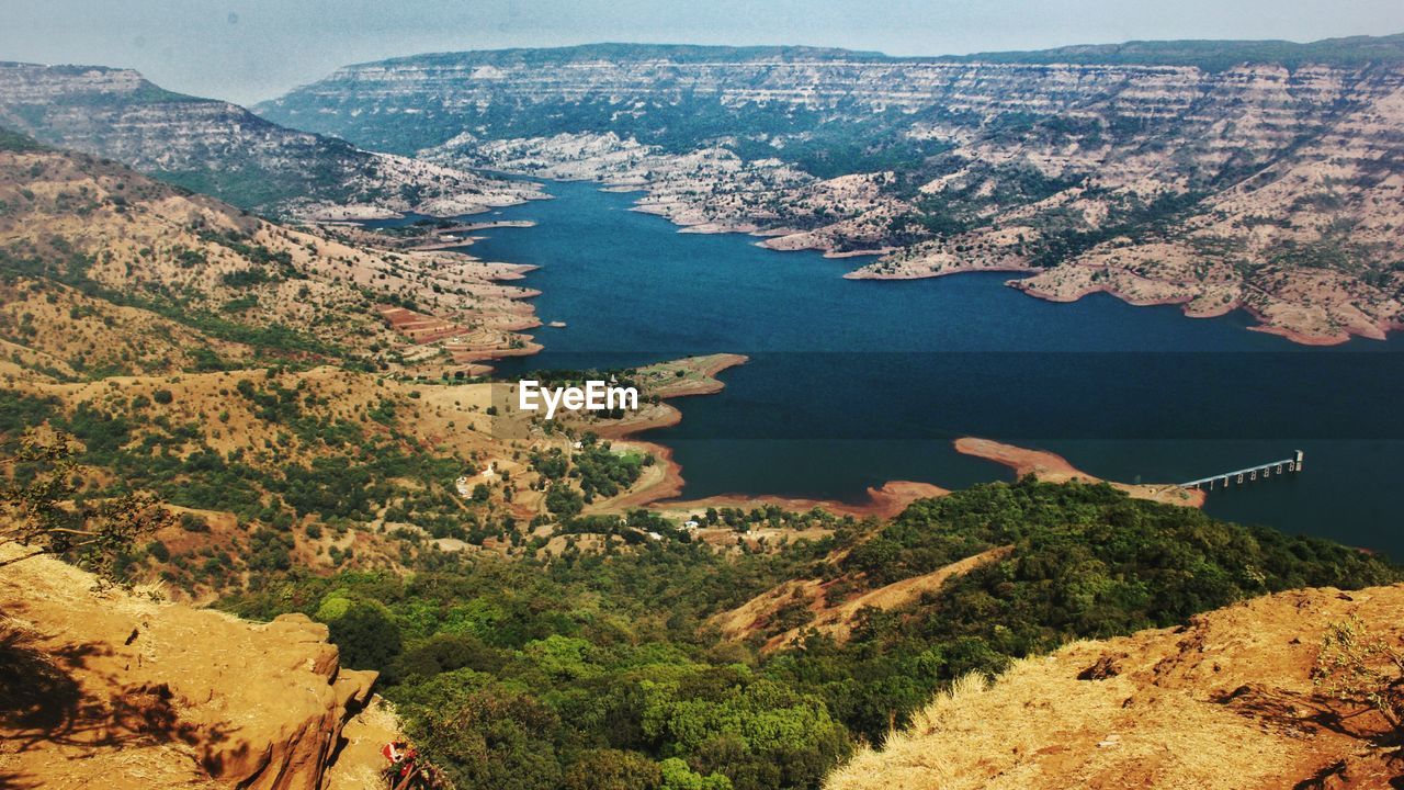 High angle view of landscape and sea against sky