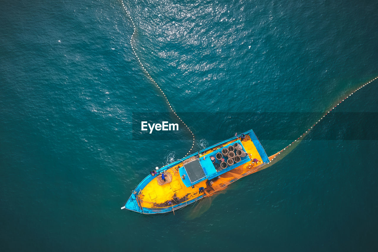 High angle view of sailboat in sea