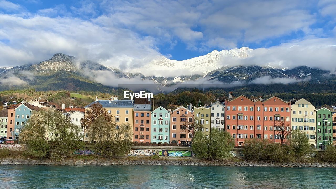 Tirol innsbruck old town buildings with river and mountains