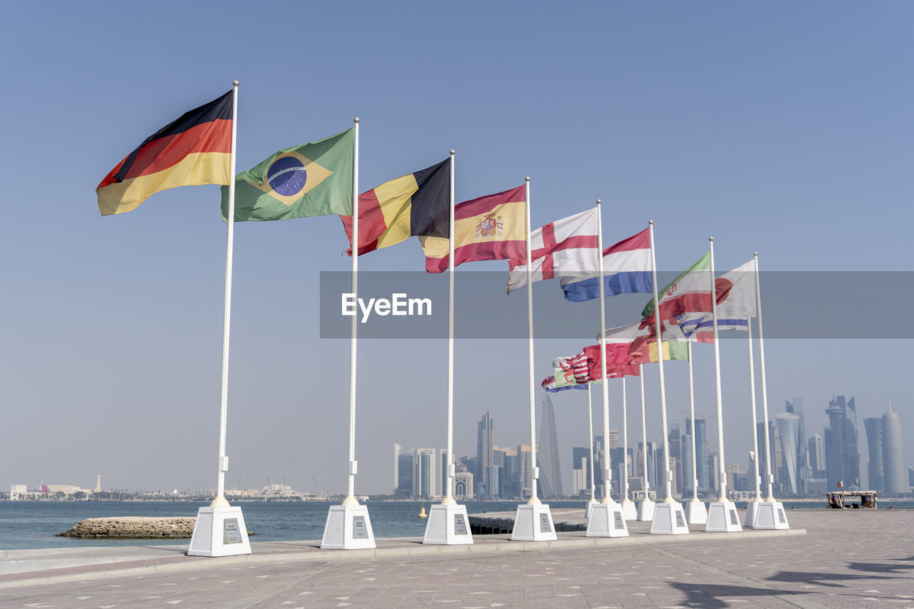 Flags of nations qualified for world cup qatar 2022 hoisted at doha corniche, qatar.