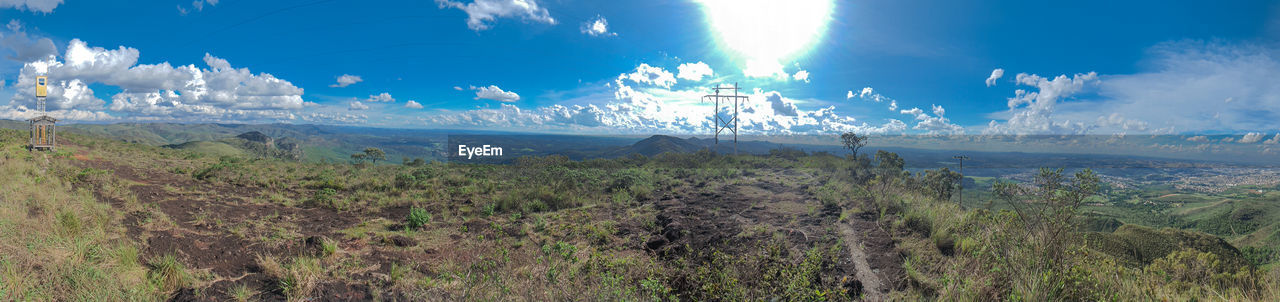 PANORAMIC VIEW OF LANDSCAPE AGAINST BLUE SKY