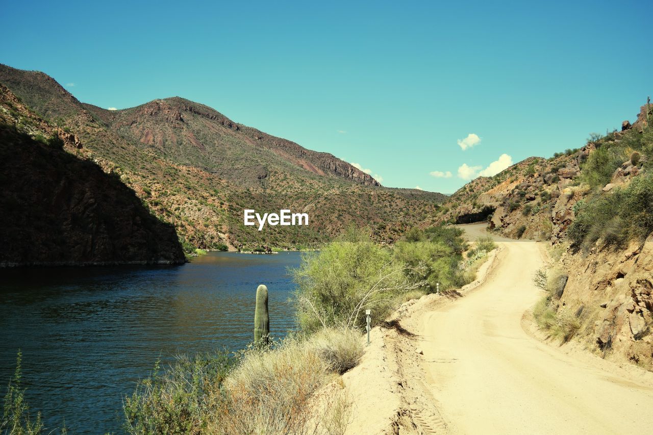 Scenic view of mountains against clear blue sky