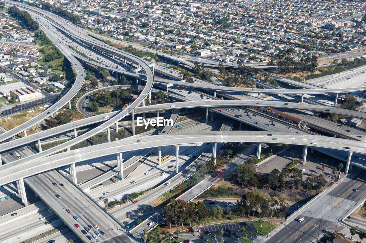 HIGH ANGLE VIEW OF ELEVATED ROAD AND CITYSCAPE