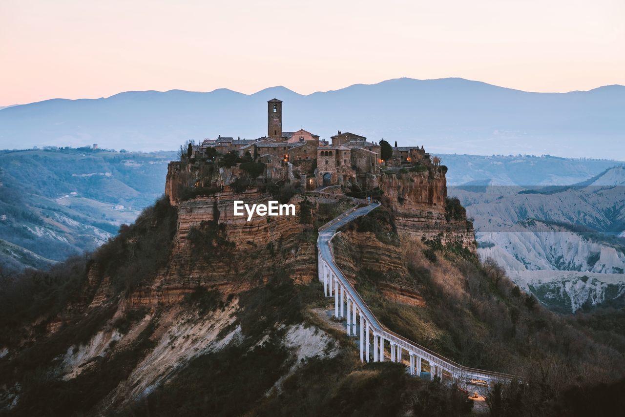 Castle on mountain against sky