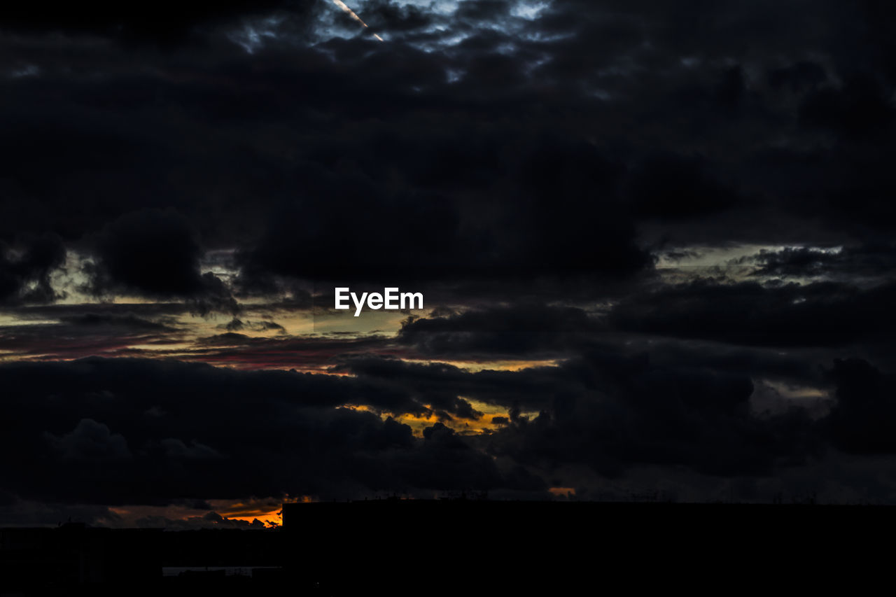 STORM CLOUDS OVER LANDSCAPE