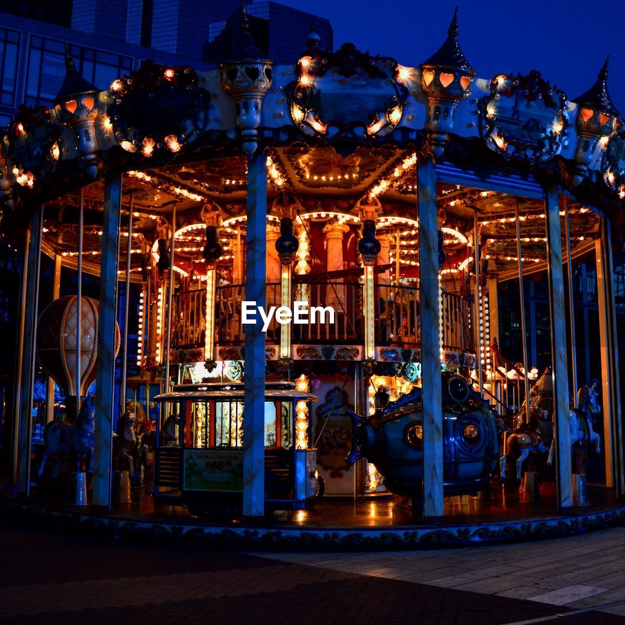 ILLUMINATED FERRIS WHEEL AT DUSK