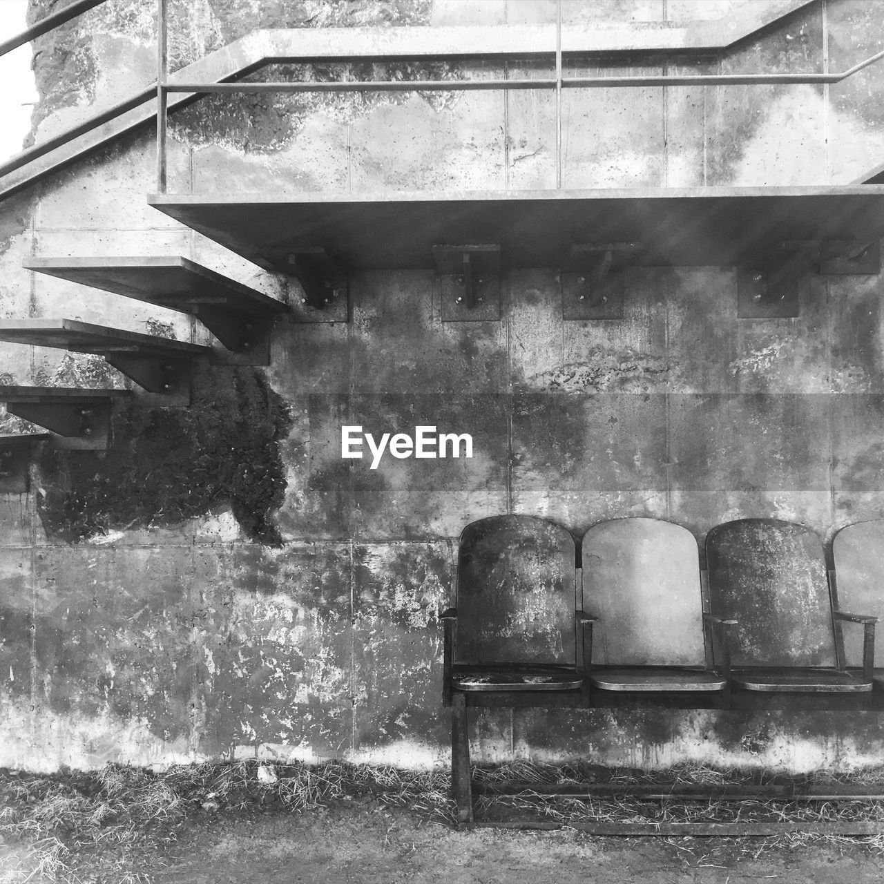 EMPTY CHAIRS IN ABANDONED BUILDING