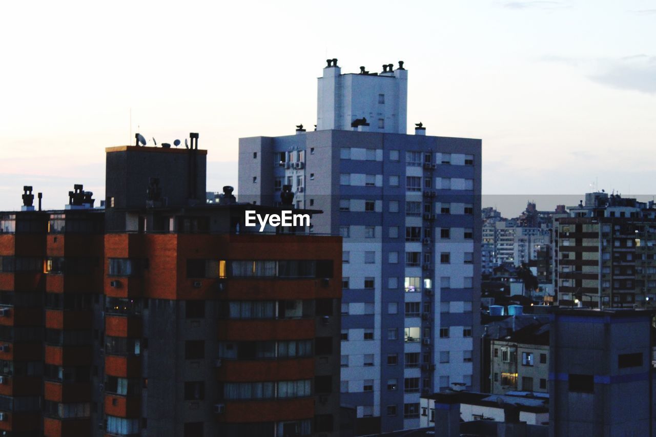 Buildings in city against sky