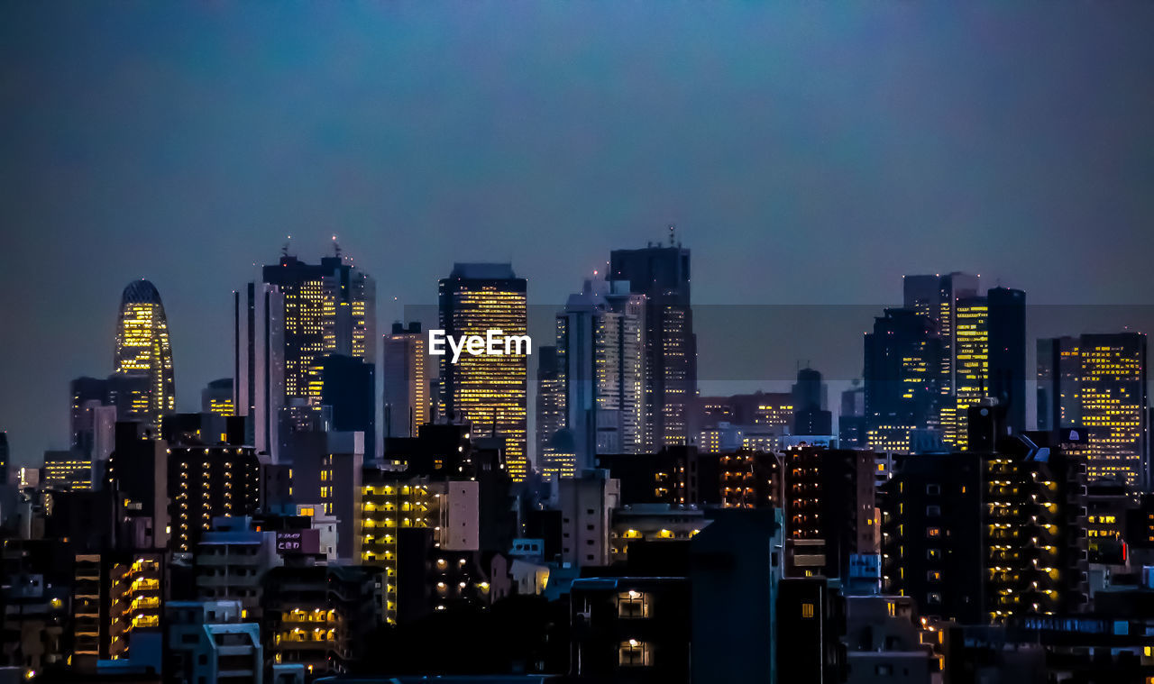 Illuminated buildings in city at night