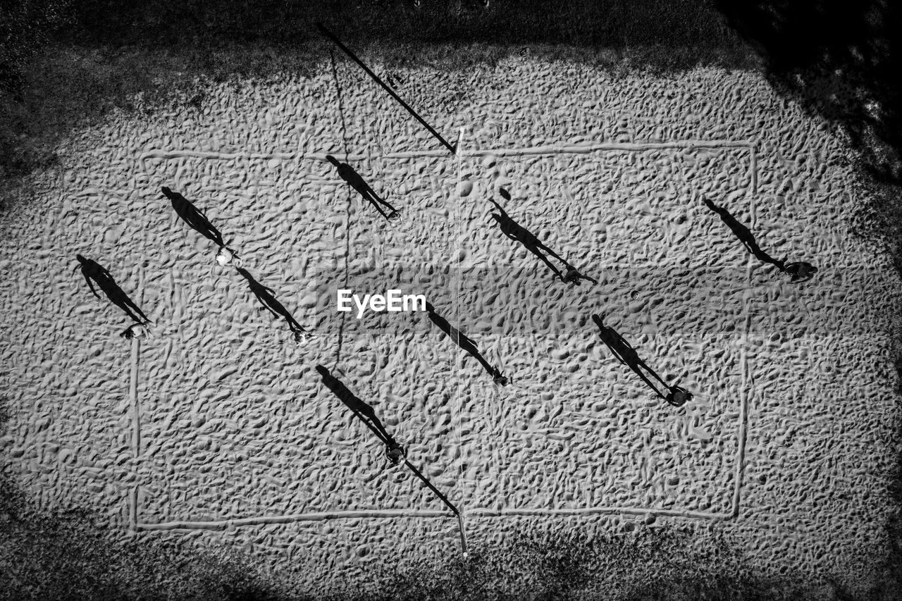 High angle view of people playing beach volleyball on sand