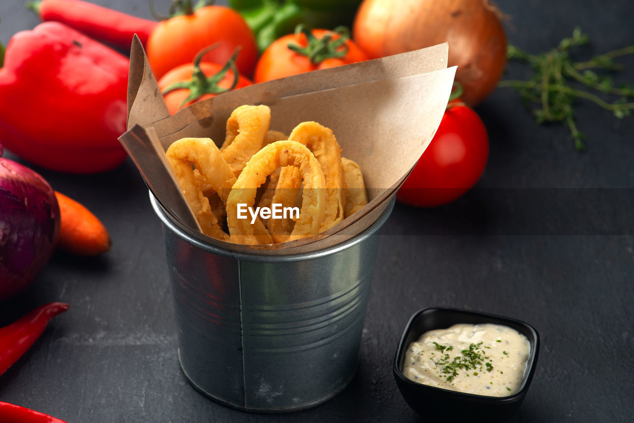 HIGH ANGLE VIEW OF VEGETABLES IN CONTAINER ON TABLE