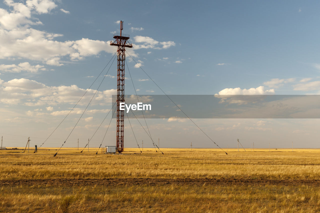 LOW ANGLE VIEW OF WIND TURBINES ON LAND