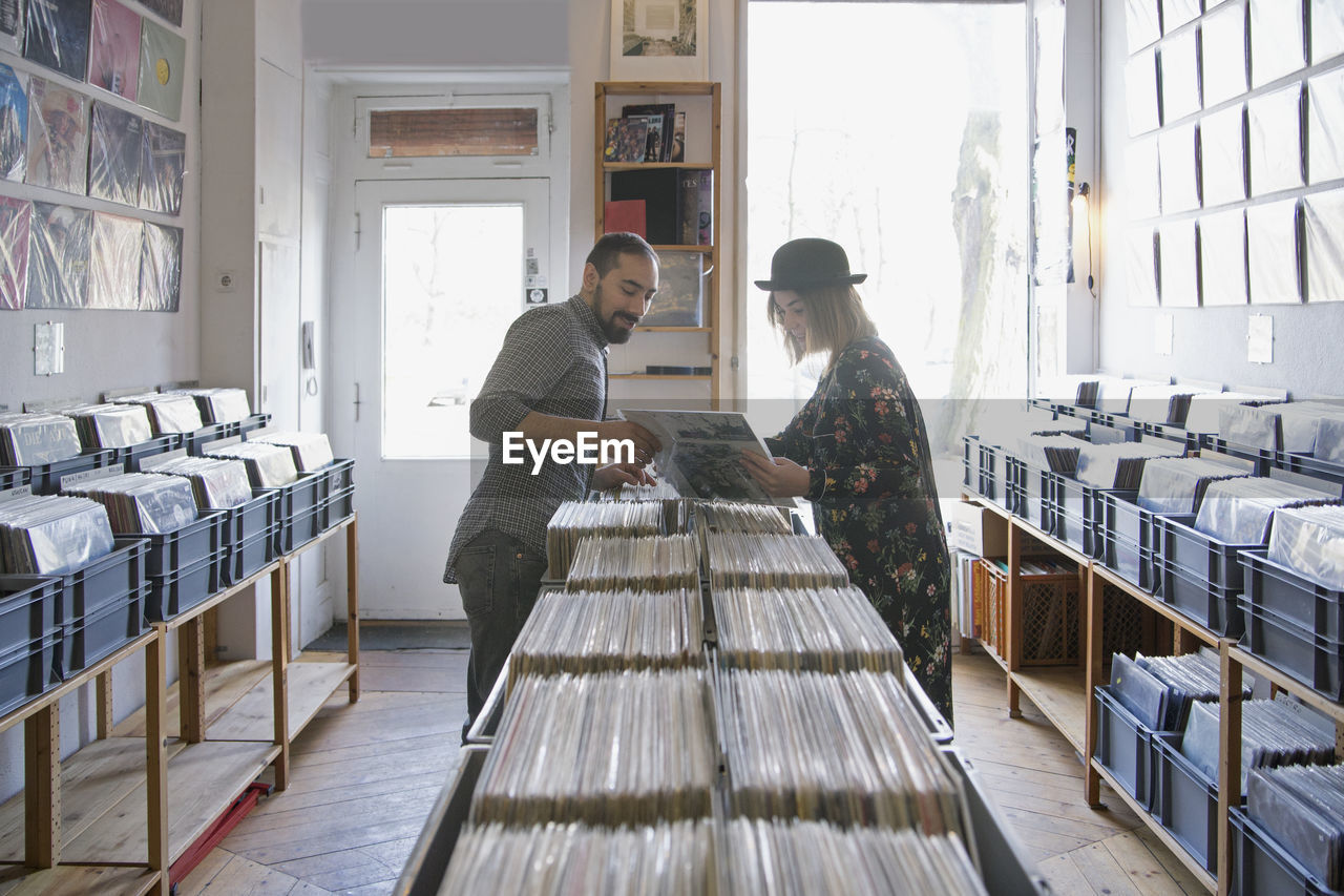 Young couple shopping for records together