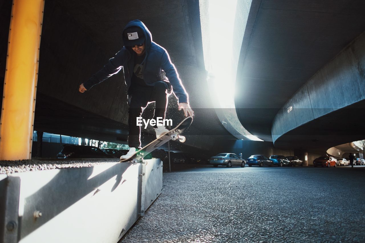 Low angle view of man balancing on skateboard