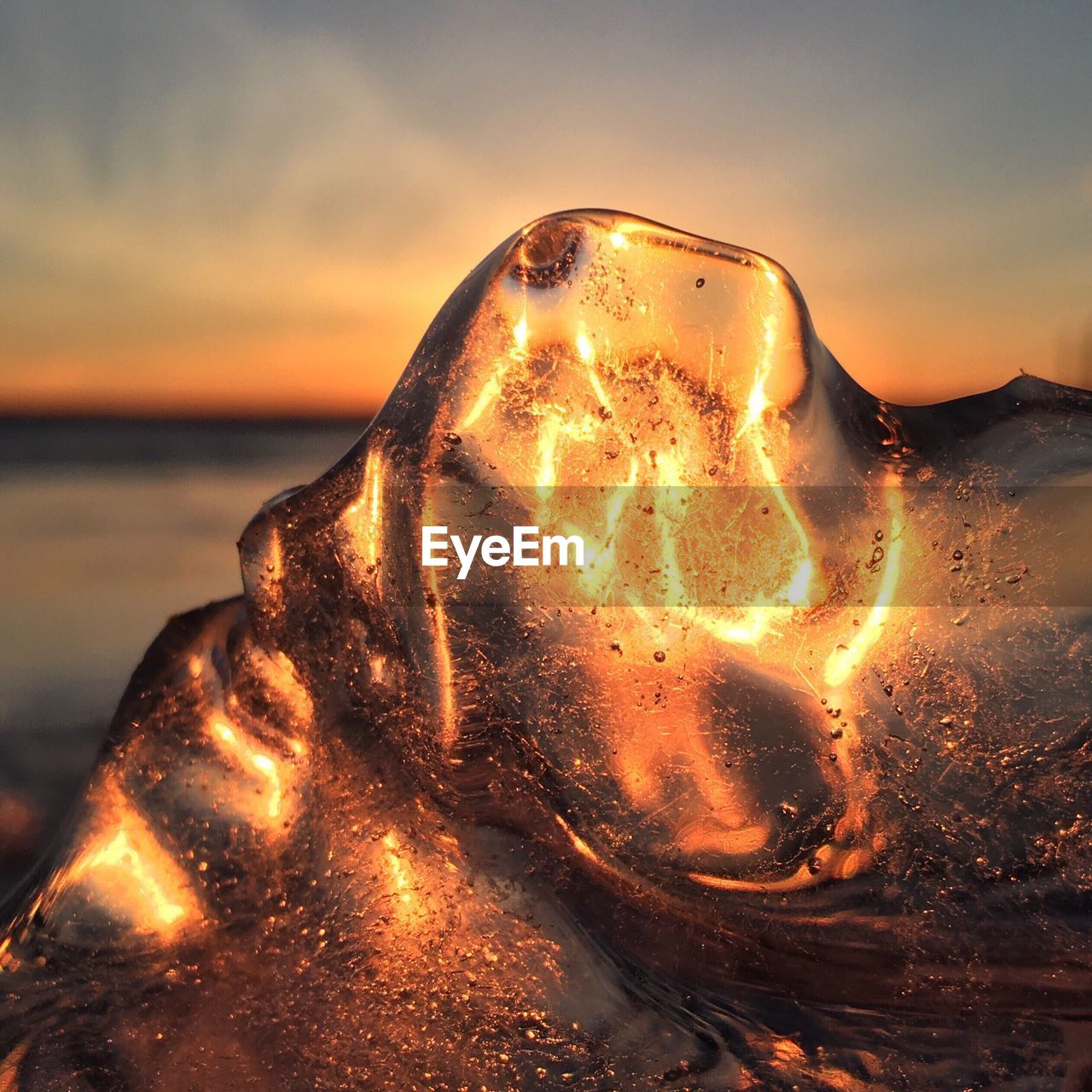 Close-up of water on beach during sunset