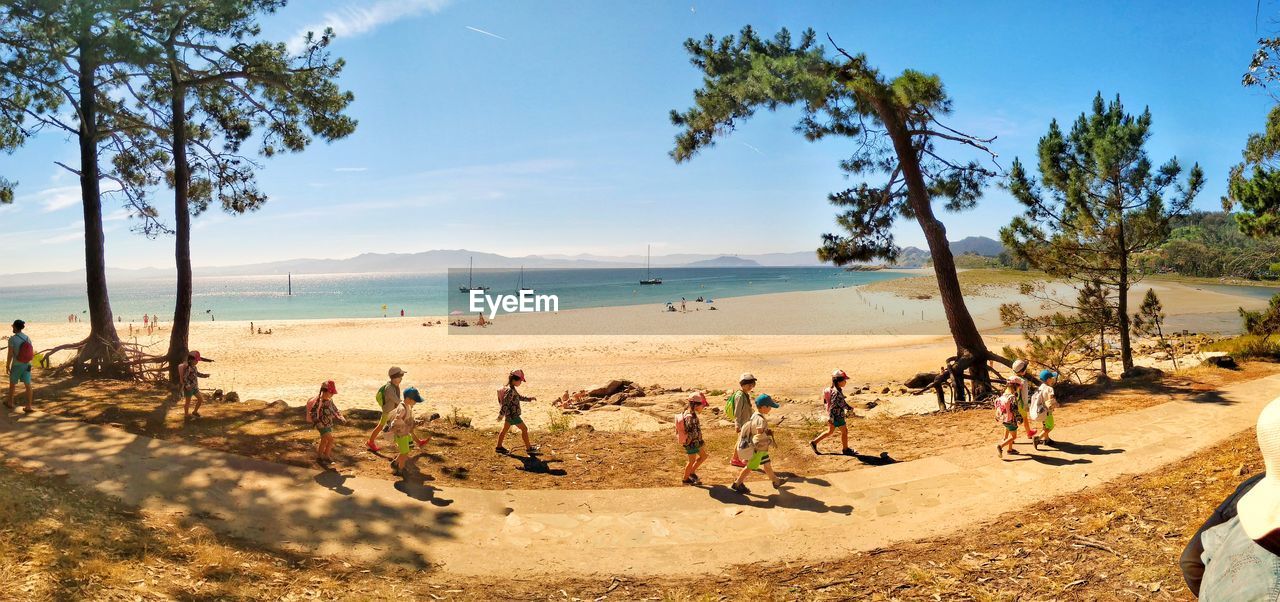 GROUP OF PEOPLE ON BEACH