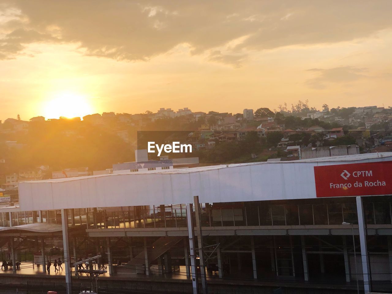 TEXT ON BRIDGE AGAINST SKY DURING SUNSET