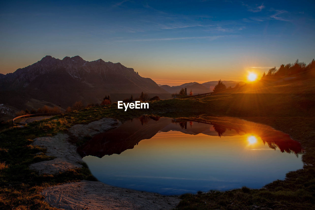 Scenic view of mountains against sky during sunset