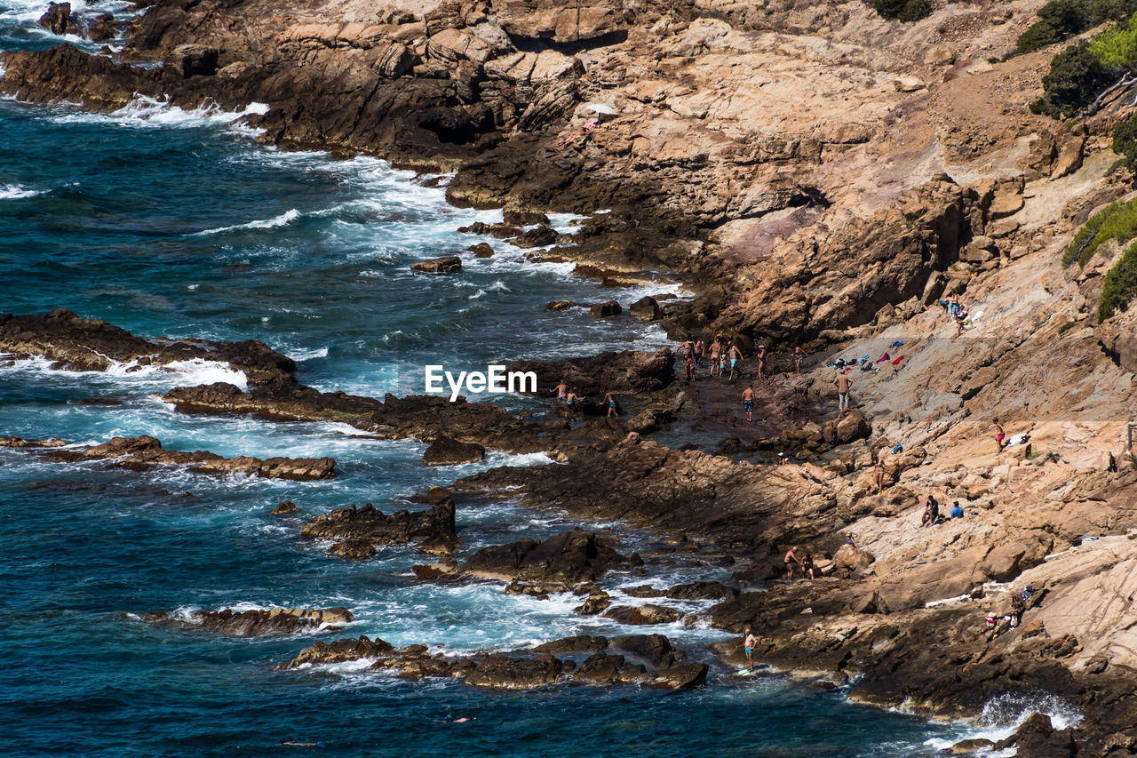 Scenic view of rocks in water against sky