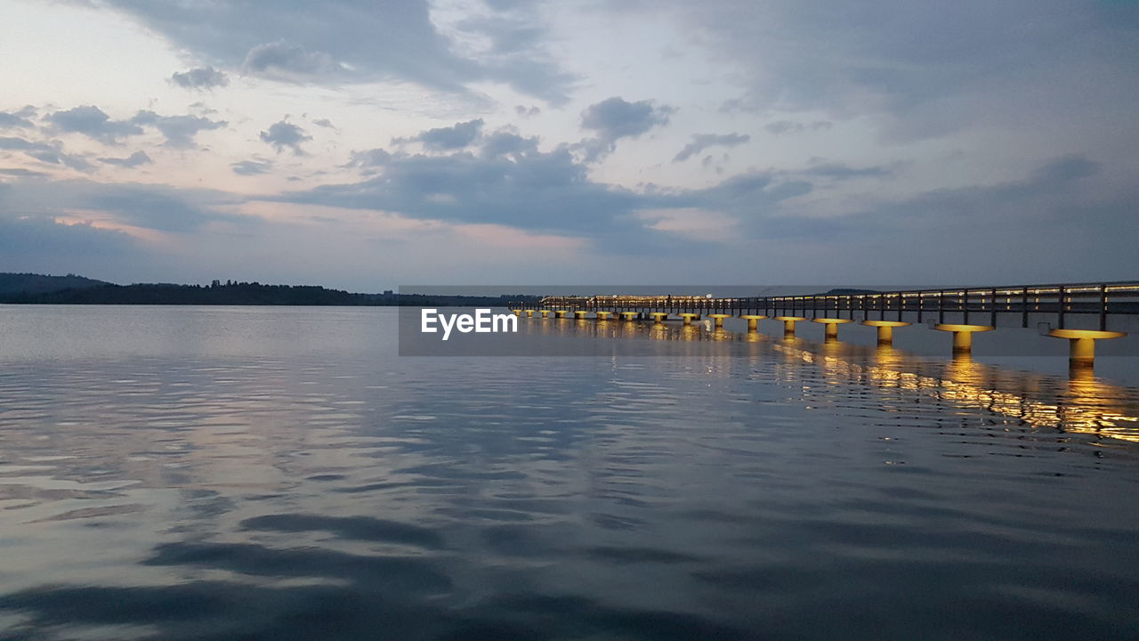 Scenic view of sea against sky at sunset