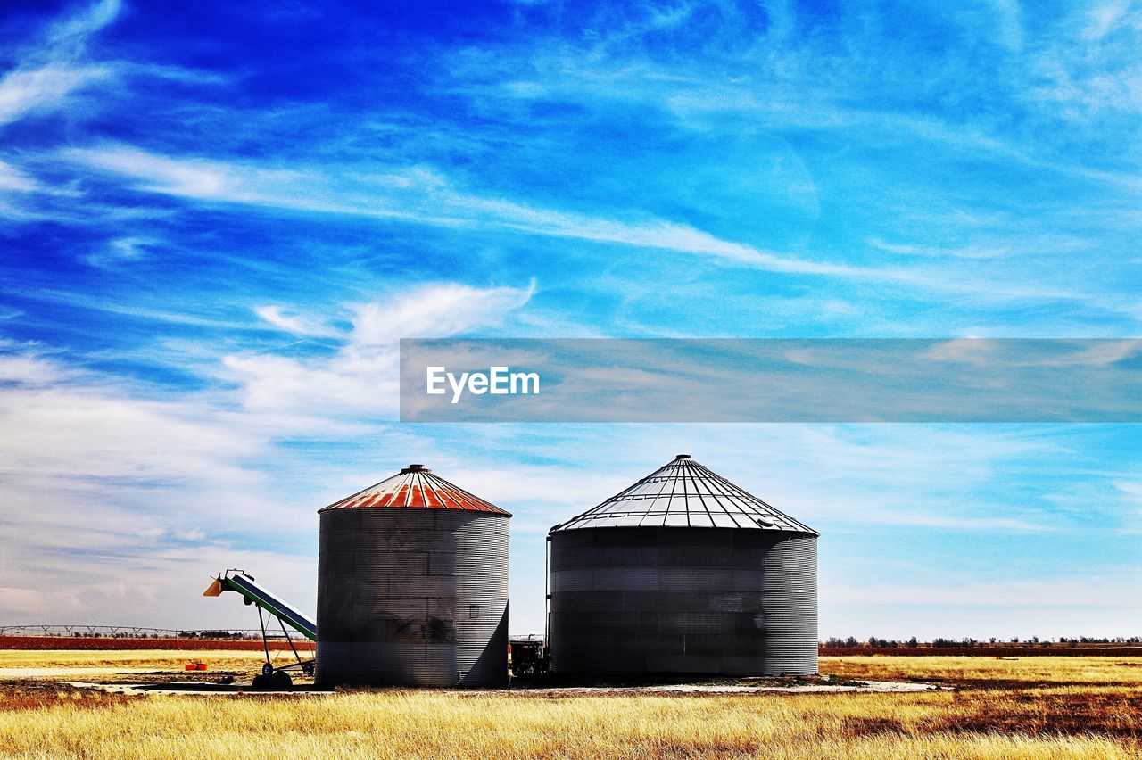 Corn cribs in the texas plains with blue sky