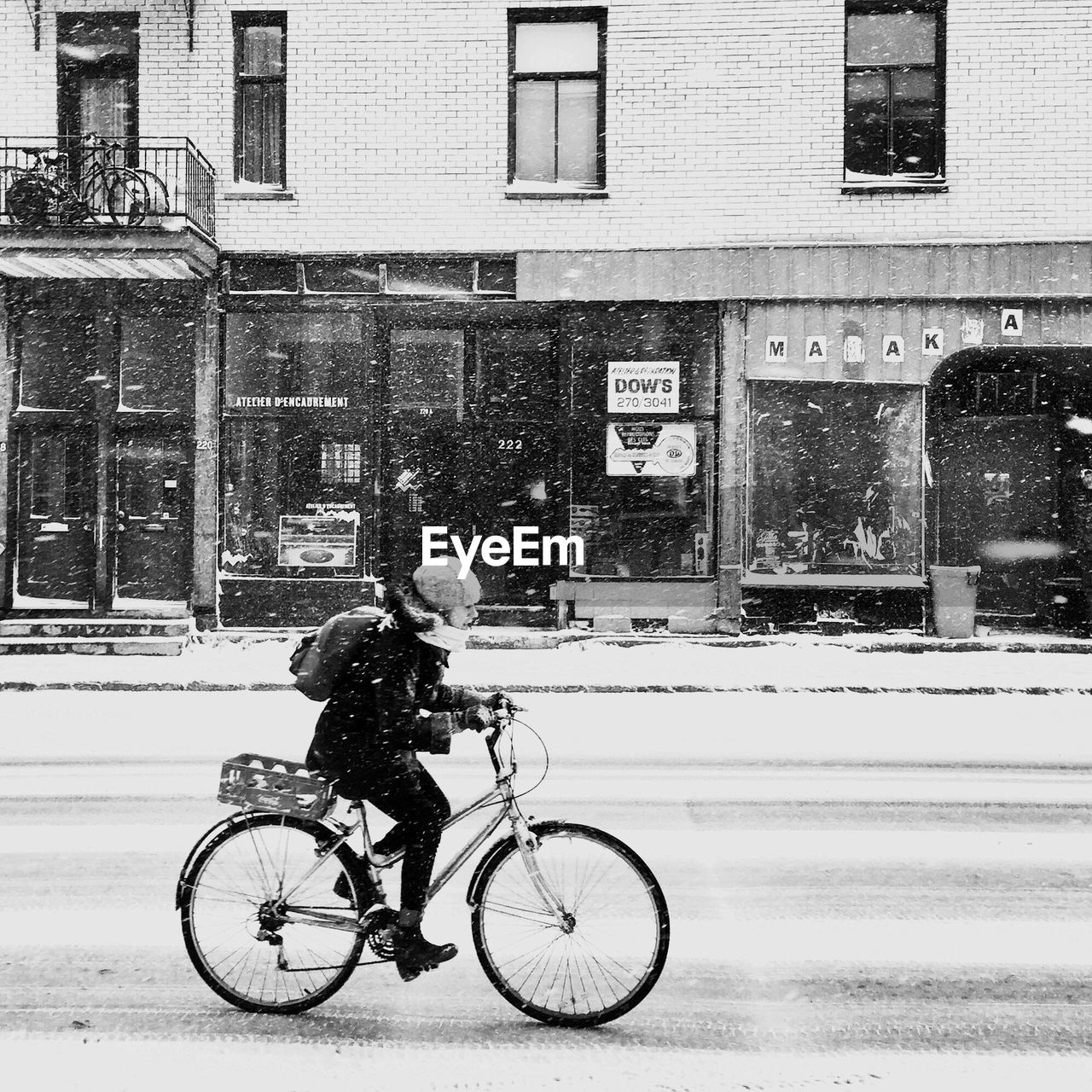 FULL LENGTH OF MAN WITH BICYCLE ON ROAD