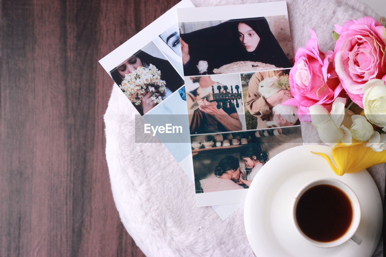 HIGH ANGLE VIEW OF COFFEE CUP ON TABLE AT HOME