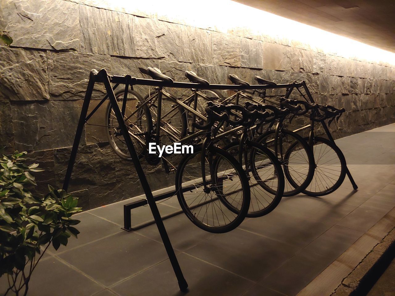 BICYCLE PARKED ON TILED FLOOR